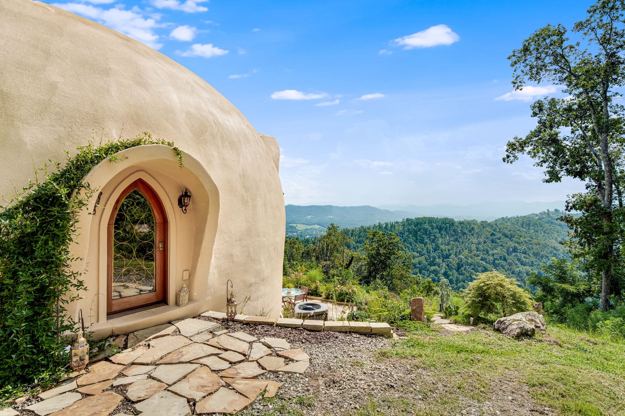 Evening view of the dome home and surrounding forest
