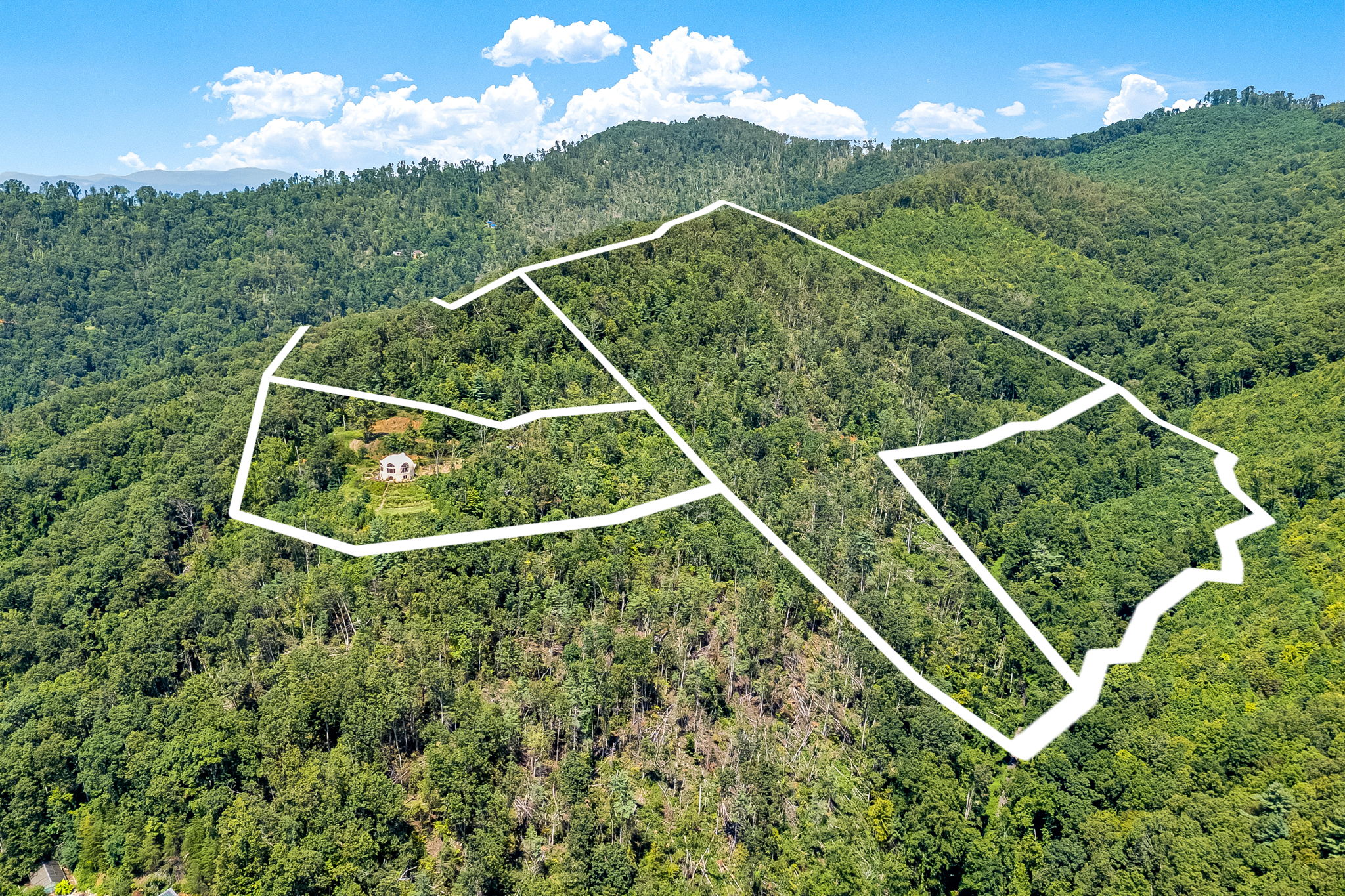 Panoramic mountain views from the property hilltop