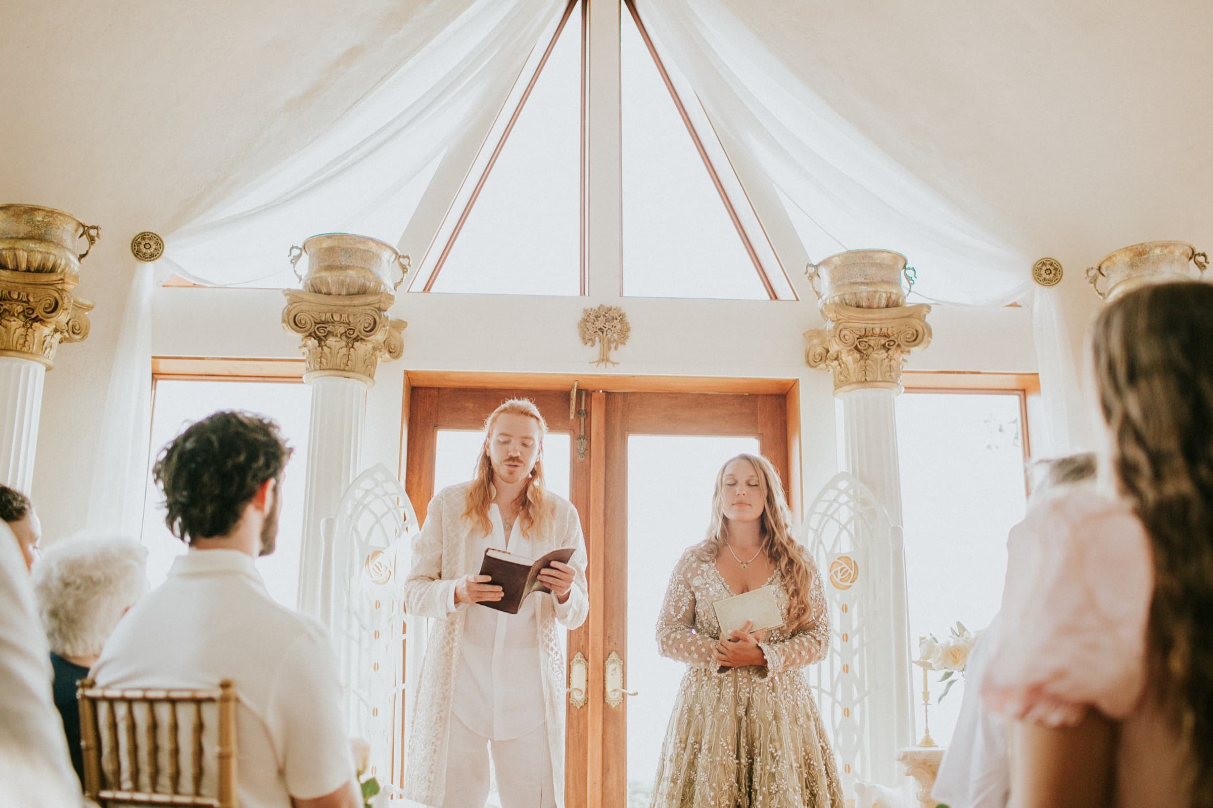 Vows read during a wedding ceremony inside the dome home at Azura