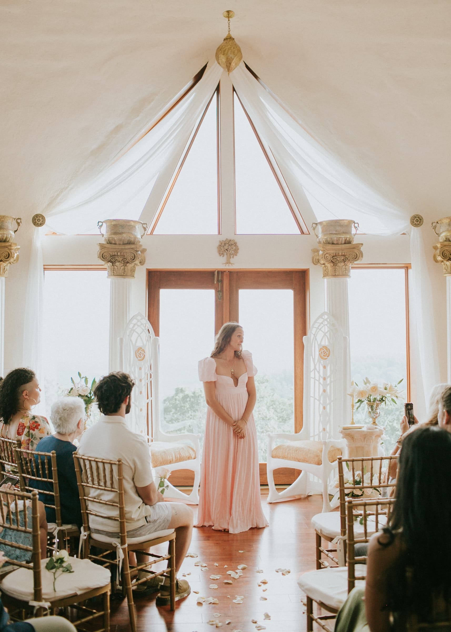 Wedding ceremony beneath the dome's cathedral windows at Azura