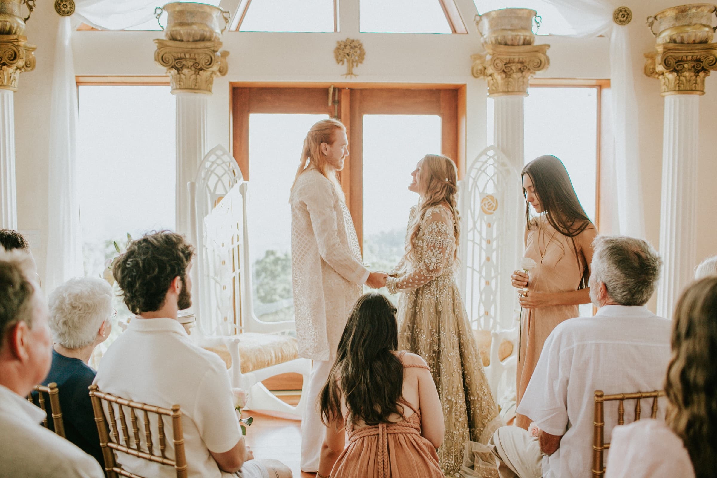 Wedding ceremony beneath the dome's cathedral windows at Azura