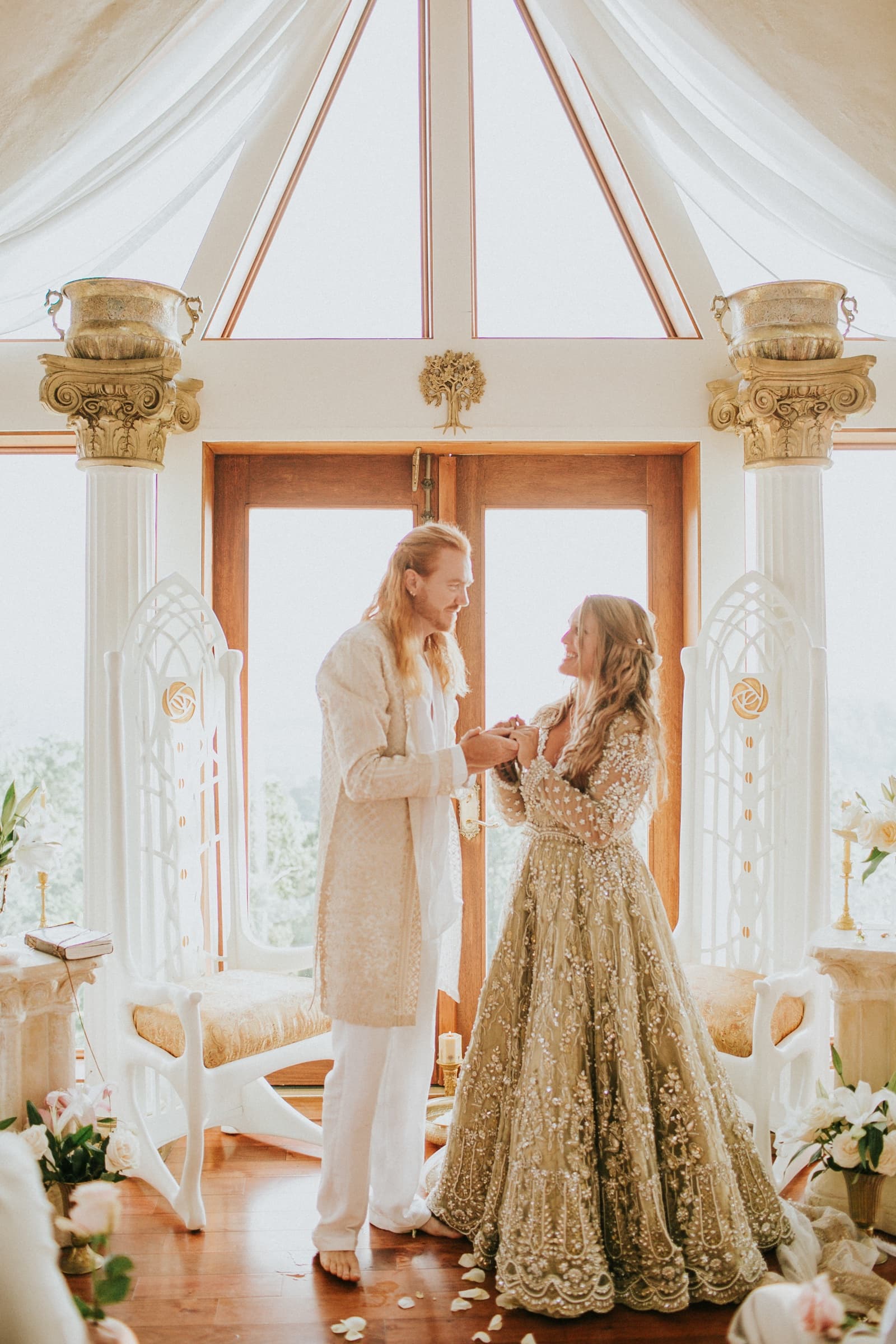 Wedding ceremony beneath the dome's cathedral windows at Azura